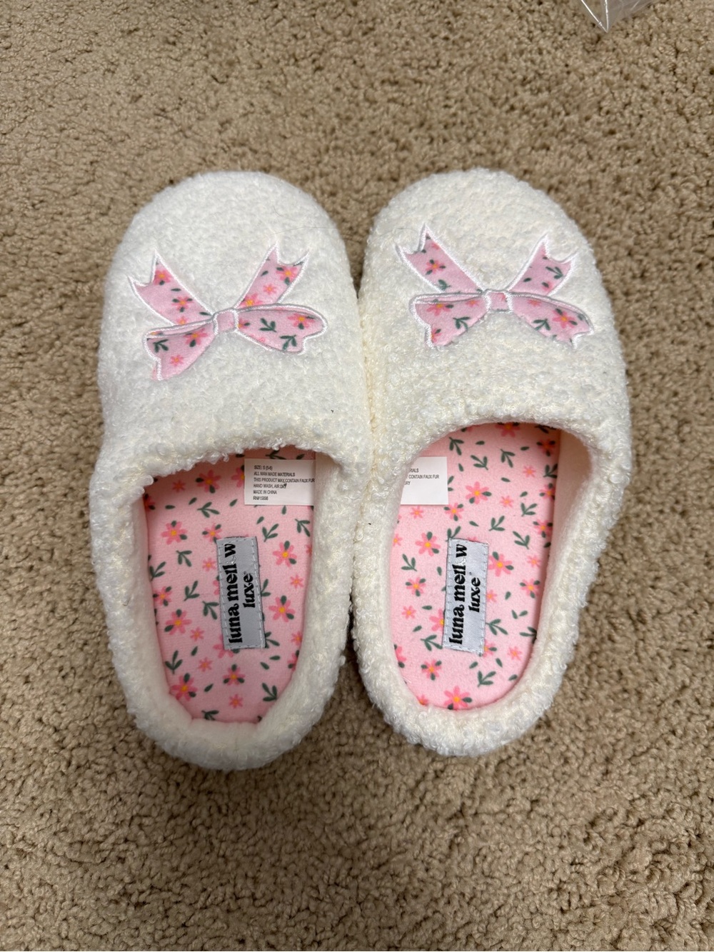 Soft Cream Fuzzy Slippers with Pink Bow Detail